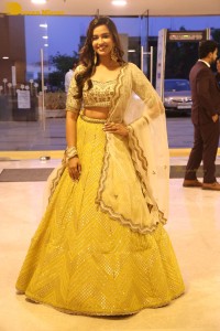 Actress Pujita Ponnada in a yellow dress while attending a movie function