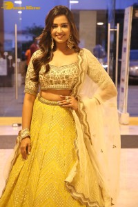 Actress Pujita Ponnada in a yellow dress while attending a movie function