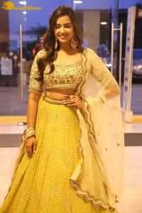 Actress Pujita Ponnada in a yellow dress while attending a movie function