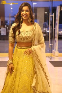 Actress Pujita Ponnada in a yellow dress while attending a movie function