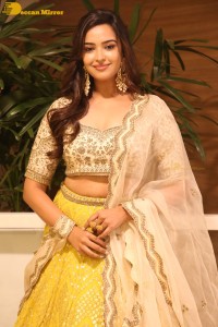 Actress Pujita Ponnada in a yellow dress while attending a movie function
