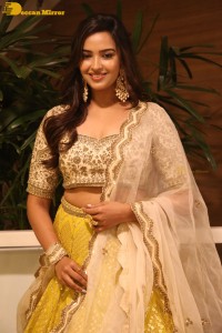 Actress Pujita Ponnada in a yellow dress while attending a movie function