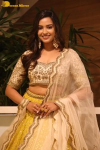 Actress Pujita Ponnada in a yellow dress while attending a movie function