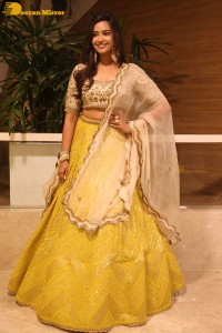 Actress Pujita Ponnada in a yellow dress while attending a movie function