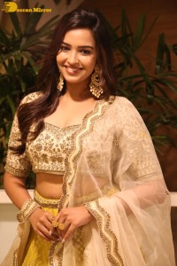 Actress Pujita Ponnada in a yellow dress while attending a movie function