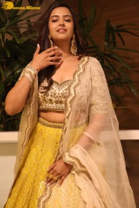 Actress Pujita Ponnada in a yellow dress while attending a movie function
