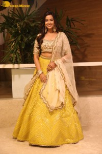 Actress Pujita Ponnada in a yellow dress while attending a movie function