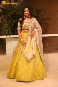 Actress Pujita Ponnada in a yellow dress while attending a movie function