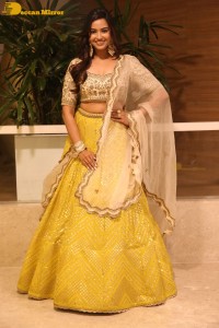 Actress Pujita Ponnada in a yellow dress while attending a movie function