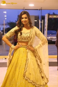 Actress Pujita Ponnada in a yellow dress while attending a movie function