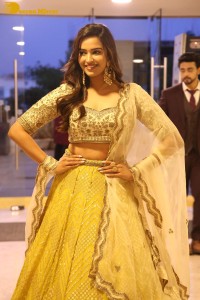 Actress Pujita Ponnada in a yellow dress while attending a movie function