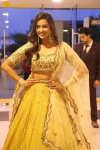 Actress Pujita Ponnada in a yellow dress while attending a movie function