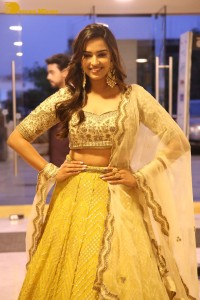 Actress Pujita Ponnada in a yellow dress while attending a movie function