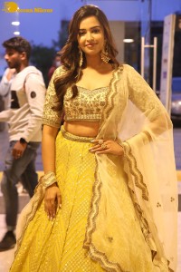 Actress Pujita Ponnada in a yellow dress while attending a movie function