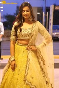 Actress Pujita Ponnada in a yellow dress while attending a movie function
