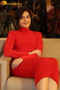 Raashi Khanna in a red dress while attending the press meet of the movie Pakka Commercial