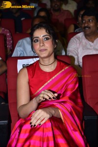 Actress Raashi Khanna cute in a red saree while attending a movie function