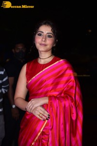 Actress Raashi Khanna cute in a red saree while attending a movie function