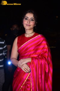 Actress Raashi Khanna cute in a red saree while attending a movie function