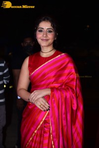 Actress Raashi Khanna cute in a red saree while attending a movie function