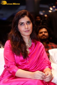 Raashi Khanna in a pink dress during a press meet