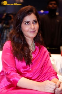 Raashi Khanna in a pink dress during a press meet