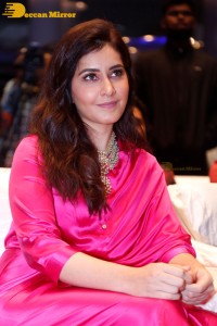 Raashi Khanna in a pink dress during a press meet