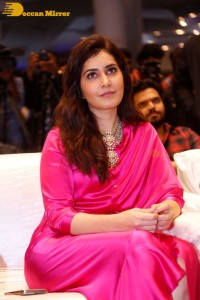 Raashi Khanna in a pink dress during a press meet