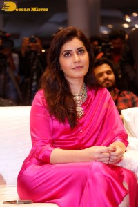Raashi Khanna in a pink dress during a press meet