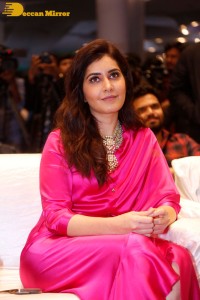 Raashi Khanna in a pink dress during a press meet