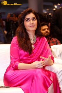 Raashi Khanna in a pink dress during a press meet