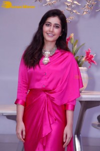 Raashi Khanna in a pink dress during a press meet