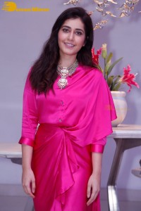 Raashi Khanna in a pink dress during a press meet