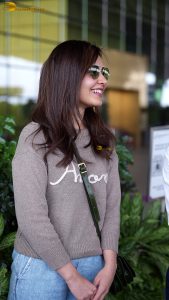 actress raashi khanna beautiful in a t-shirt and sunglasses