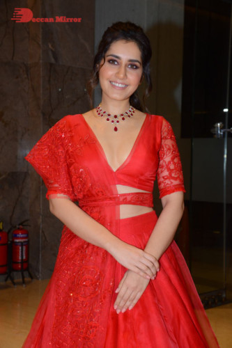 Telugu Actress Raashi Khanna looking beautiful in a red dress at a movie function