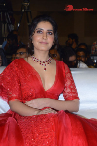 Telugu Actress Raashi Khanna looking beautiful in a red dress at a movie function