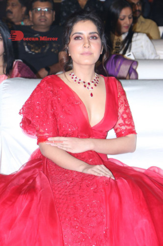 Telugu Actress Raashi Khanna looking beautiful in a red dress at a movie function