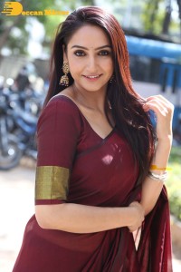 Actress Ragini Dwivedi in a brownish red saree
