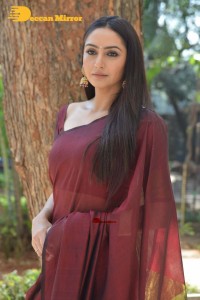 Actress Ragini Dwivedi in a brownish red saree