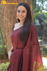 Actress Ragini Dwivedi in a brownish red saree
