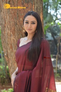 Actress Ragini Dwivedi in a brownish red saree