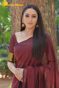 Actress Ragini Dwivedi in a brownish red saree