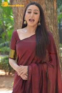 Actress Ragini Dwivedi in a brownish red saree