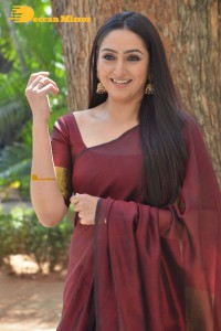 Actress Ragini Dwivedi in a brownish red saree
