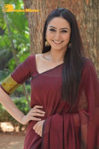 Actress Ragini Dwivedi in a brownish red saree