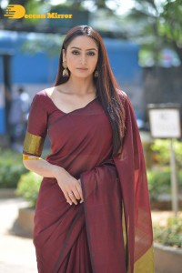 Actress Ragini Dwivedi in a brownish red saree