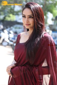 Actress Ragini Dwivedi in a brownish red saree