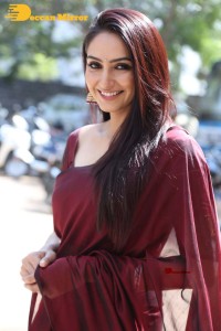 Actress Ragini Dwivedi in a brownish red saree