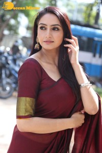 Actress Ragini Dwivedi in a brownish red saree