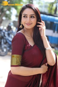 Actress Ragini Dwivedi in a brownish red saree